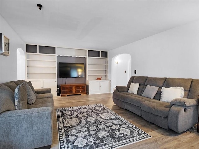 746 Dewitt Rd, Webster, NY 14580 - living room with arched walkways and wood finished floors