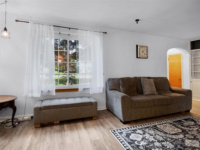 746 Dewitt Rd, Webster, NY 14580 - living area featuring arched walkways and wood finished floors