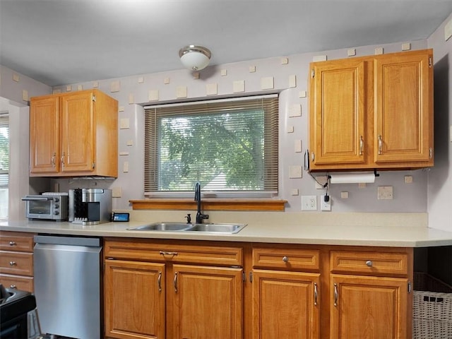 746 Dewitt Rd, Webster, NY 14580 - kitchen with stainless steel dishwasher, light countertops, and brown cabinetry