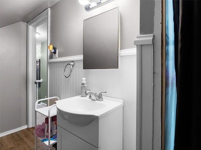 746 Dewitt Rd, Webster, NY 14580 - bathroom with vanity, wood finished floors, and a wainscoted wall