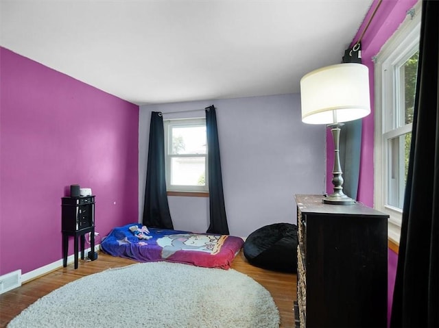 746 Dewitt Rd, Webster, NY 14580 - bedroom featuring wood finished floors and baseboards