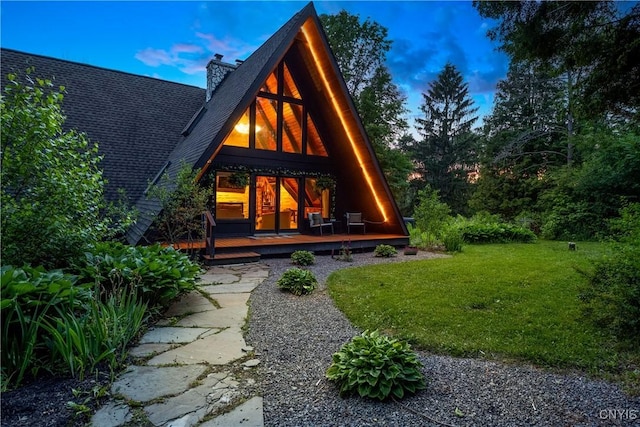 6139 Commane Rd, Lafayette, NY 13084 - back of house featuring a lawn, a chimney, and roof with shingles