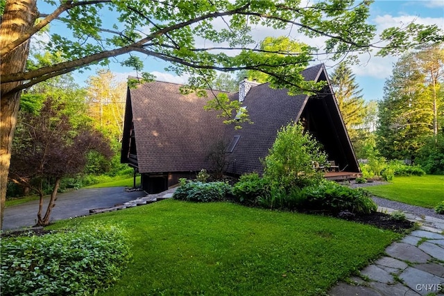 6139 Commane Rd, Lafayette, NY 13084 - view of side of home featuring a yard, roof with shingles, and a chimney