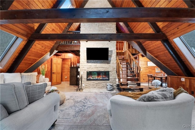 6139 Commane Rd, Lafayette, NY 13084 - living room with wood ceiling, a fireplace, stairs, and wooden walls