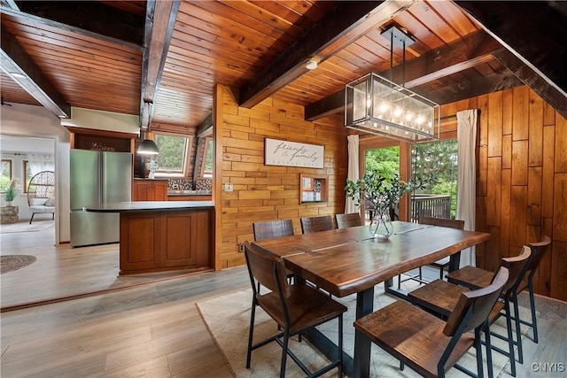 6139 Commane Rd, Lafayette, NY 13084 - dining space featuring a wooden ceiling with exposed beams, wooden walls, plenty of natural light, light wood-type flooring, and a chandelier