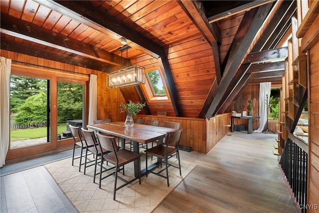 6139 Commane Rd, Lafayette, NY 13084 - dining room with wood walls, wooden ceiling, healthy amount of natural light, light wood-style floors, and a chandelier