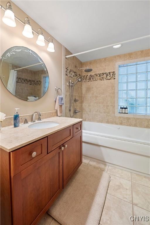 6139 Commane Rd, Lafayette, NY 13084 - bathroom featuring vanity, tile patterned flooring, and shower / bathtub combination with curtain