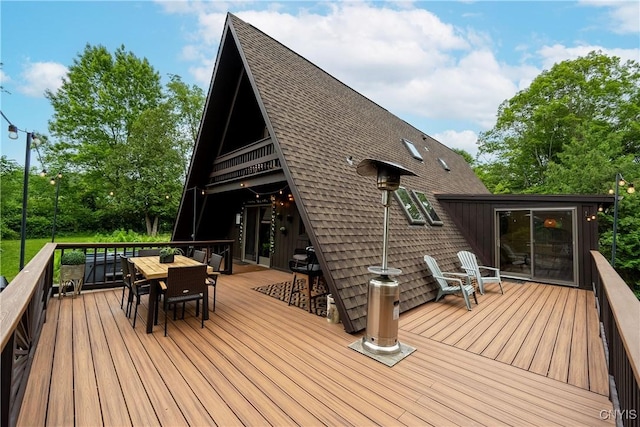 6139 Commane Rd, Lafayette, NY 13084 - wooden terrace featuring outdoor dining area
