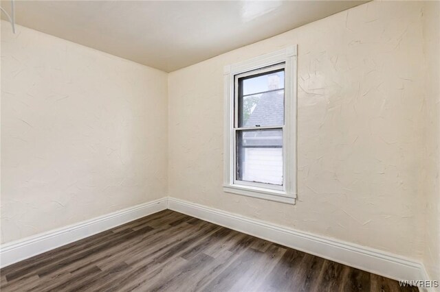 76 Chester St, Buffalo, NY 14208 - spare room with dark wood finished floors and baseboards