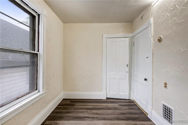 76 Chester St, Buffalo, NY 14208 - unfurnished room featuring dark wood finished floors and baseboards