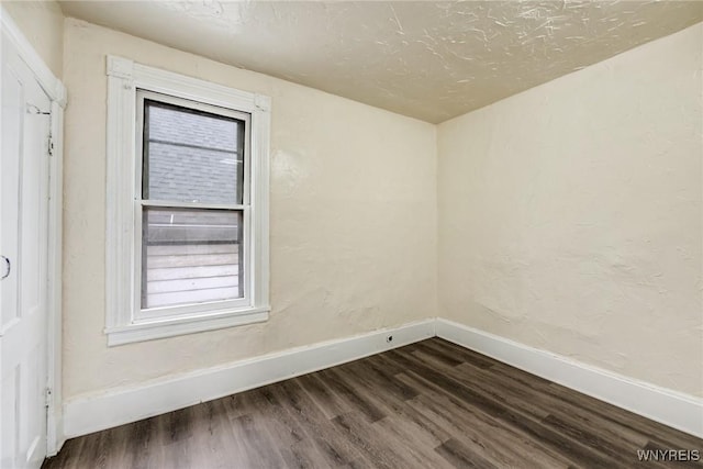 76 Chester St, Buffalo, NY 14208 - empty room with dark wood-type flooring and healthy amount of natural light