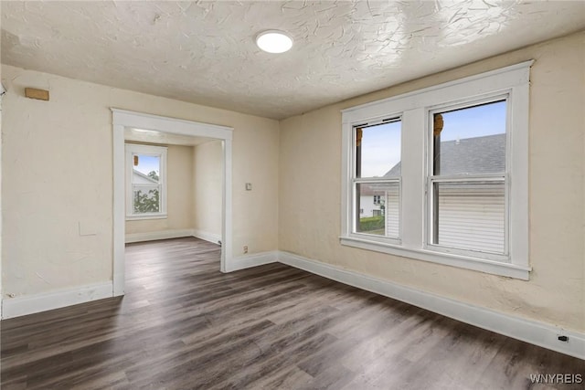 76 Chester St, Buffalo, NY 14208 - unfurnished room with plenty of natural light, dark wood-style flooring, and a textured ceiling