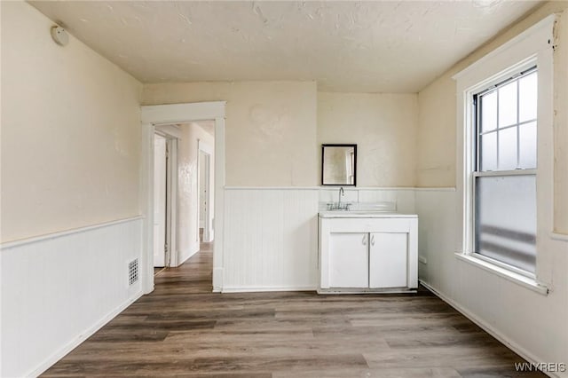 76 Chester St, Buffalo, NY 14208 - spare room featuring a wainscoted wall and wood finished floors