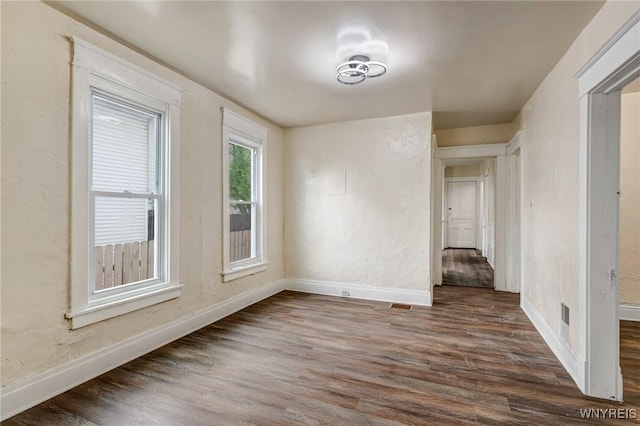 76 Chester St, Buffalo, NY 14208 - unfurnished room featuring baseboards and dark wood finished floors