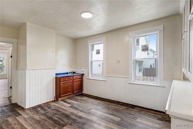 76 Chester St, Buffalo, NY 14208 - unfurnished dining area with a wainscoted wall and dark wood finished floors