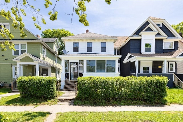 36.5 Austin St, Rochester, NY 14606 - american foursquare style home featuring a chimney