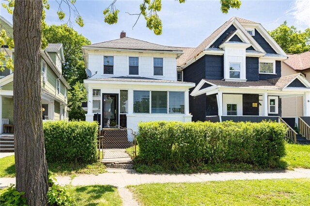 36.5 Austin St, Rochester, NY 14606 - traditional style home featuring a chimney and a shingled roof