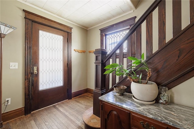 36.5 Austin St, Rochester, NY 14606 - entrance foyer with light wood-type flooring, crown molding, and stairway