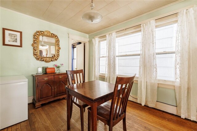 36.5 Austin St, Rochester, NY 14606 - dining area featuring crown molding, wood-type flooring, and plenty of natural light