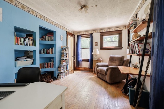 36.5 Austin St, Rochester, NY 14606 - office space with hardwood / wood-style floors, built in features, and crown molding