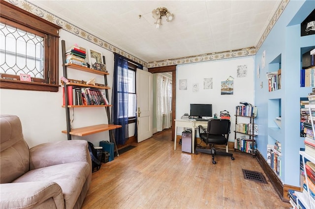 36.5 Austin St, Rochester, NY 14606 - home office with hardwood / wood-style flooring and ornamental molding