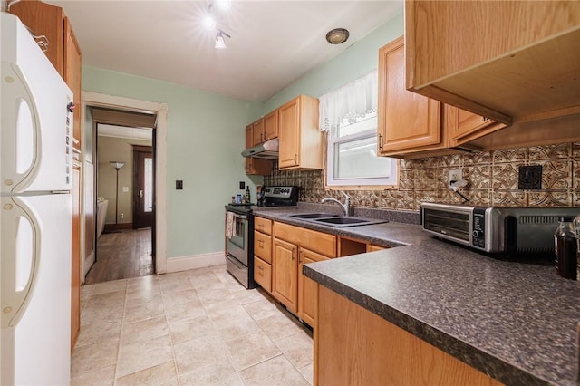 36.5 Austin St, Rochester, NY 14606 - kitchen featuring stainless steel electric range, freestanding refrigerator, dark countertops, under cabinet range hood, and backsplash