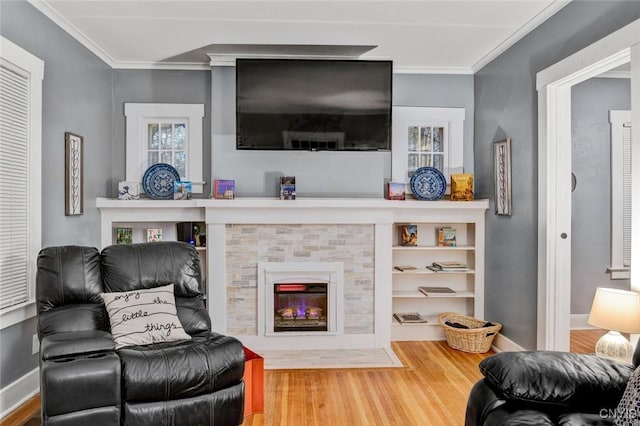301 Arlington Ave Unit 3, Syracuse, NY 13207 - living area featuring wood finished floors, ornamental molding, and a tiled fireplace