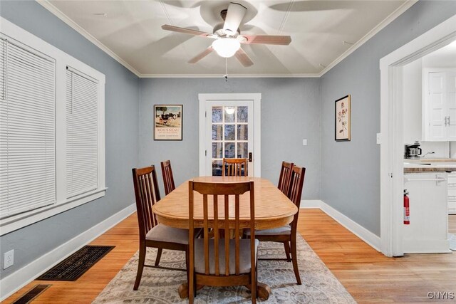 301 Arlington Ave Unit 3, Syracuse, NY 13207 - dining area featuring ceiling fan, light wood finished floors, and ornamental molding