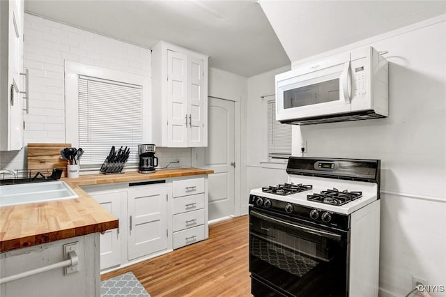 301 Arlington Ave Unit 3, Syracuse, NY 13207 - kitchen with wood counters, range with gas cooktop, white microwave, and white cabinetry