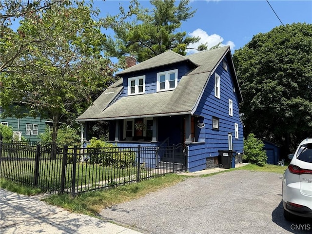 301 Arlington Ave Unit 3, Syracuse, NY 13207 - view of front of property featuring covered porch, a chimney, and a fenced front yard