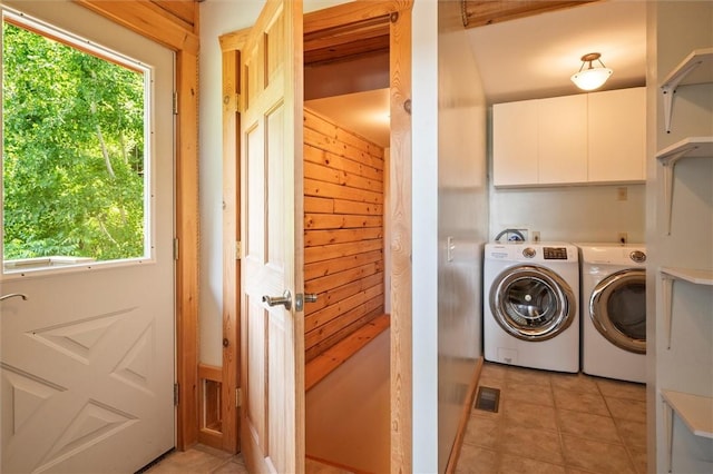 6094 State Route 21, South Bristol, NY 14512 - washroom with washer and clothes dryer, plenty of natural light, and light tile patterned floors