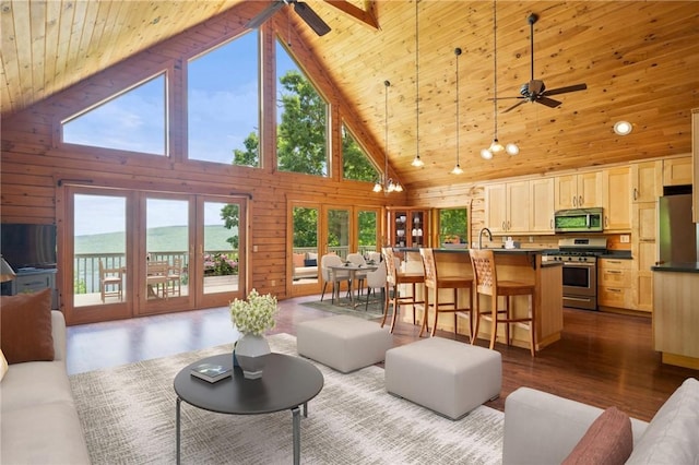 6094 State Route 21, South Bristol, NY 14512 - living area featuring a ceiling fan, a wooden ceiling with exposed beams, high vaulted ceiling, dark wood-style floors, and wooden walls