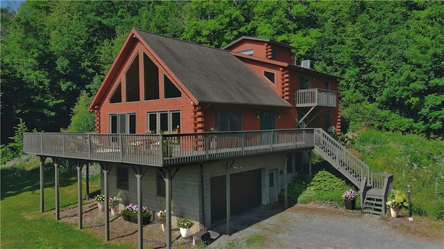 6094 State Route 21, South Bristol, NY 14512 - rear view of property featuring log siding, stairs, a wooden deck, and a forest view