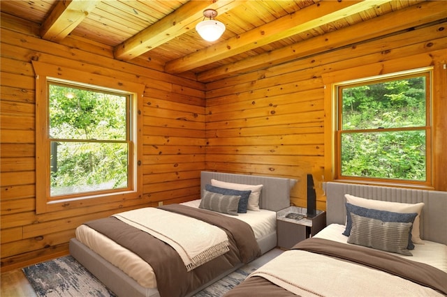 6094 State Route 21, South Bristol, NY 14512 - bedroom with a wooden ceiling with exposed beams, wood walls, and wood finished floors