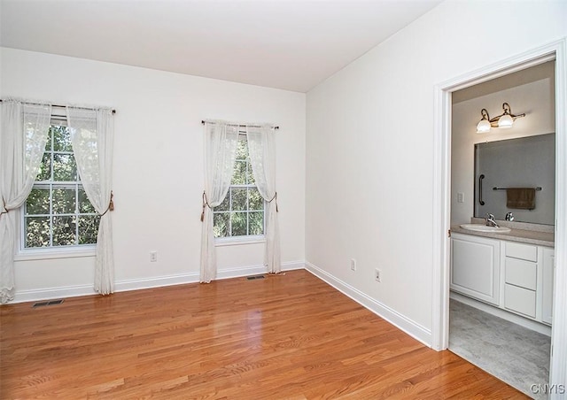 4203 Sandbar Ln, Clay, NY 13090 - unfurnished room with light wood finished floors and plenty of natural light