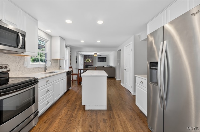 208 Single Dr, Clay, NY 13212 - kitchen featuring stainless steel appliances, light countertops, dark wood-style floors, white cabinets, and recessed lighting