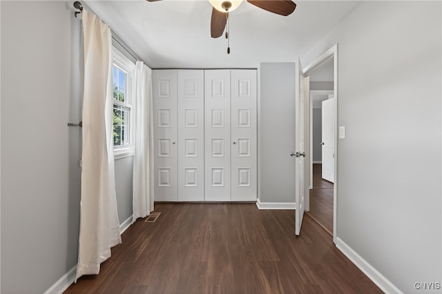 208 Single Dr, Clay, NY 13212 - unfurnished bedroom featuring dark wood-style flooring, a closet, and ceiling fan