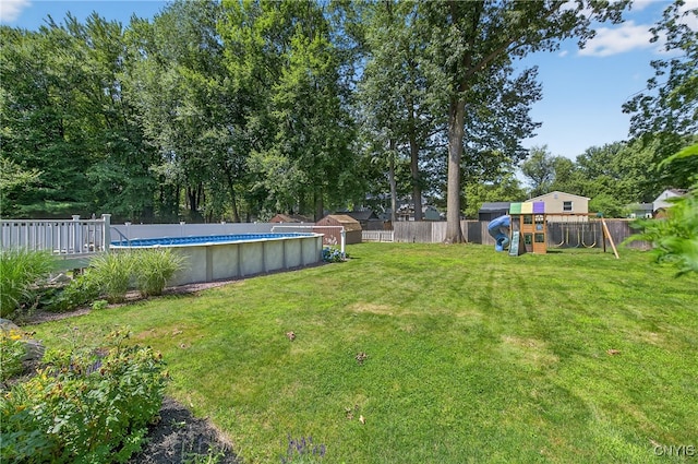 208 Single Dr, Clay, NY 13212 - fenced backyard featuring a playground and a shed