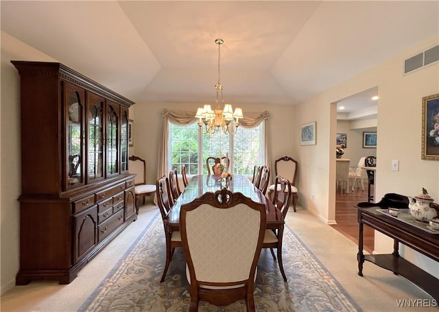 39 Wickendon Ct, Amherst, NY 14221 - dining area featuring light colored carpet, a chandelier, and lofted ceiling