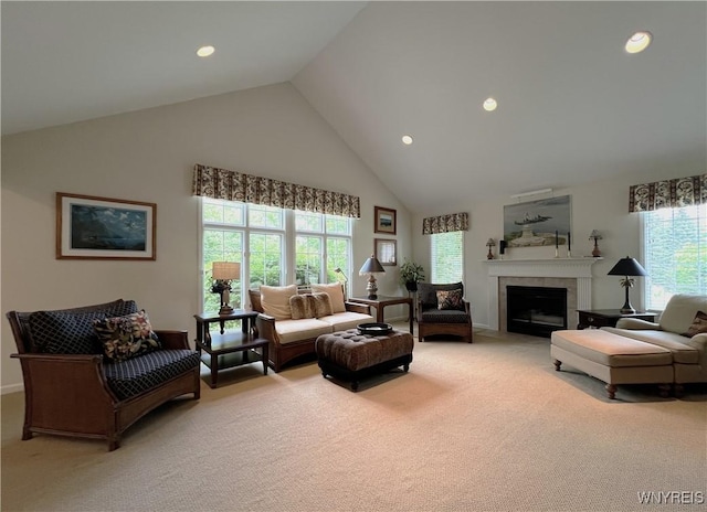 39 Wickendon Ct, Amherst, NY 14221 - living area featuring high vaulted ceiling, light carpet, a fireplace with flush hearth, and recessed lighting