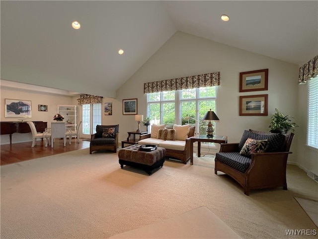 39 Wickendon Ct, Amherst, NY 14221 - living area featuring high vaulted ceiling, light carpet, and recessed lighting