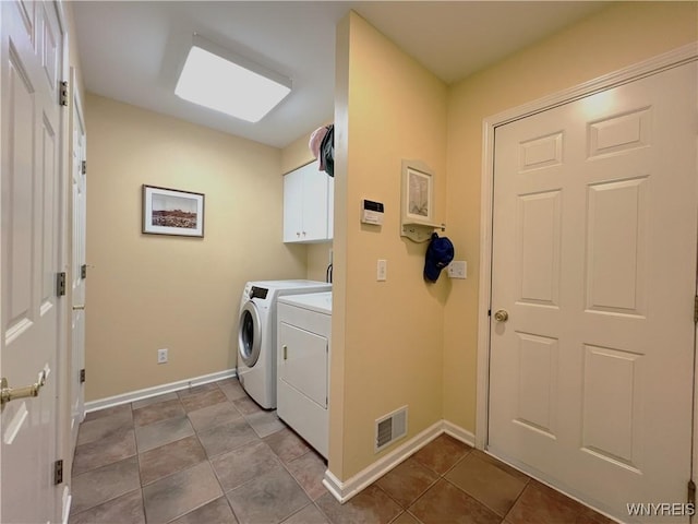 39 Wickendon Ct, Amherst, NY 14221 - laundry area featuring cabinet space, independent washer and dryer, and light tile patterned flooring