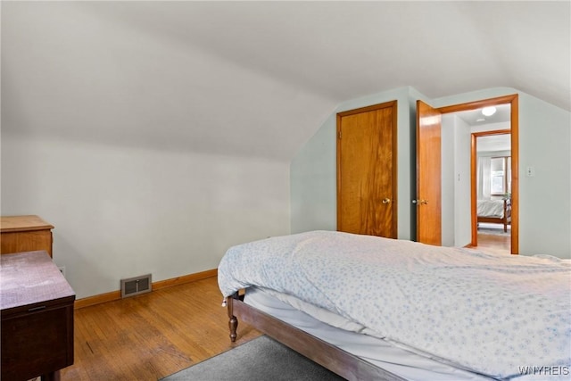 301 Pleasant View Dr, Lancaster, NY 14086 - bedroom with wood finished floors and lofted ceiling