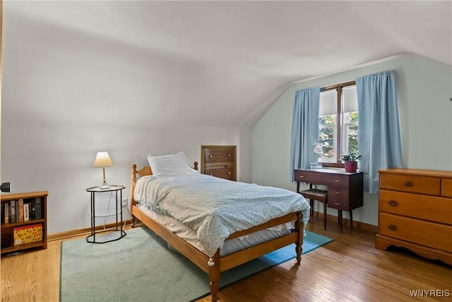 301 Pleasant View Dr, Lancaster, NY 14086 - bedroom featuring vaulted ceiling and wood finished floors