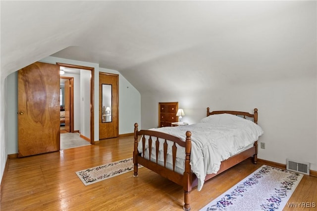 301 Pleasant View Dr, Lancaster, NY 14086 - bedroom with vaulted ceiling and wood finished floors