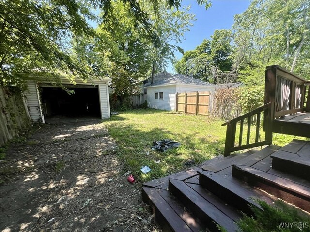 83 Andover Ave, Buffalo, NY 14215 - view of yard with a wooden deck, an outbuilding, and driveway
