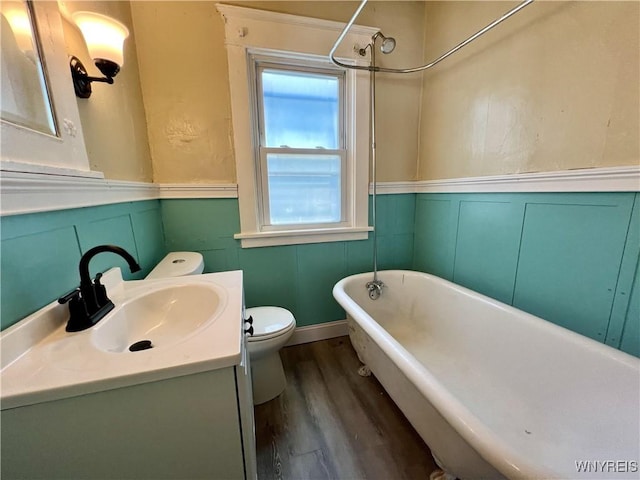 83 Andover Ave, Buffalo, NY 14215 - bathroom featuring vanity, wood finished floors, wainscoting, and a decorative wall