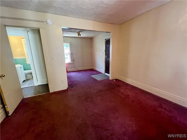 83 Andover Ave, Buffalo, NY 14215 - carpeted spare room featuring a textured ceiling and baseboards