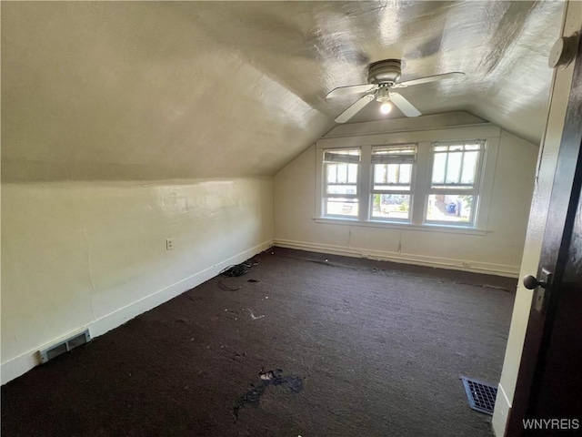 83 Andover Ave, Buffalo, NY 14215 - additional living space featuring vaulted ceiling, a ceiling fan, and dark colored carpet