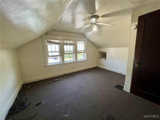 83 Andover Ave, Buffalo, NY 14215 - additional living space with dark carpet, lofted ceiling, and ceiling fan